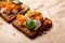 Vegetarian toast with a rich topping of pumpkin and mixed seeds. Rustic comfort food