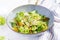 Vegetarian/ vegan salad with boiled chickpeas, greens, avocado, orange and chia seeds.