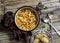 Vegetarian vegetable bean soup and parmesan cheese toasts on a wooden rustic table, top view.