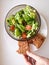 Vegetarian vegetable salad. Fresh salad flying to bowl in super slow motion. Avocado Tomato Salad