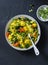 Vegetarian vegetables and yellow lentils stew on dark background