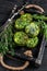 Vegetarian veggie vegetable falafel patty with herbs in a wooden tray. Black background. Top view