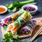 Vegetarian vietnamese spring rolls with spicy sauce, carrot, cucumber, red cabbage and rice noodl