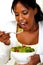 Vegetarian woman eating a attractive green salad