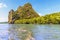 Vegetation covers a limestone island beside the channel leading to Phang Nga Bay in Thailand