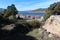 Vegetation and large stones in the El Burguillo Reservoir, Avila, Spain