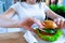 Veggie burger healthy vegan food. Salad, avocado, vegetable on vegetarian hamburger eating cute woman. Vegan sandwich