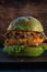 Veggie burger. wooden background. copyspace. Vertical orientation. close up