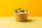 Veggie Delight Bowl tasty fast food street food for take away on yellow background