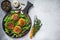 Veggie patty cutlet with lentils, vegetables and arugula. White background. Top view. Copy space