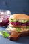 Veggie soy burger with pickled red cabbage cucumber arugula