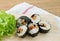 Veggie sushi rolls or vegetable maki on wooden tray
