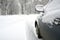 Vehicle covered with snow in winter