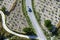 A vehicle drives down a road between fields of cultivated grape vines growing near Goreme in Turkey.