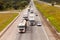 Vehicles on BR-374 highway with headlights on during the daylight obeying the new Brazilian transit laws