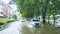 Vehicles crossing high flood on the residence