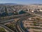 Vehicles elevating one of the most complex roads in Athens, the famous road junction at Faliro, Piraeus. Aerial view over Attica