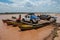 Vehicles embark on barges to cross the river