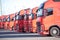 Vehicles in a modern freight forwarding service parked outdoors during daylight