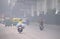 Vehicles moving in the road amidst heavy smog in Delhi..