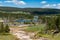 Vehicles parked along the side of the road near the Mud Volcano area of Yellowstone National Park, during the busy summer tourism