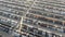 Vehicles parked on production plant parking lot at sunset