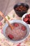 VEight treasures of health porridge in the dining tray and jujubes and raisins in the other two bowls