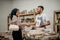 Veiled woman shakes hands during a transaction to buy stone handicrafts