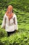 Veiled woman staring at tea plantations