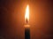 Veiw of one candle light blurred background for design stock photo, candle flame burning