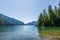 veiw from the shore to Harrison Lake british columbia Canada green land blue water and sky