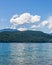 veiw from the shore to Harrison Lake british columbia Canada green land blue water and sky