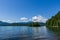 veiw from the shore to Harrison Lake british columbia Canada green land blue water and sky