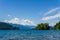 veiw from the shore to Harrison Lake british columbia Canada green land blue water and sky