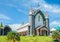 Velankanni Matha catholic church facade with palms in foreground, Nedumkandom, Kerala, South India