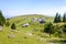 Velika planina plateau, Slovenia, Mountain village in Alps, wooden houses in traditional style, popular hiking