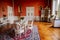 Velke Brezno, Czech Republic, 26 June 2021: Neo-Renaissance chateau Velke Brezno, castle interior, baroque furniture, red dining