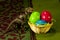 Velociraptor near colourful easter eggs on table