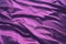 Velour fabric, similar to silk. Textiles in a folds and beautiful waves. Purple, pink, magenta shades on the drapery