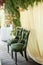 Velvet green chair with a carriage screed.Palace interior.
