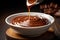 velvety chocolate sauce flows gracefully into a pristine white bowl, perfect for dessert or baking. culinary topics, or