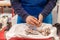 Vendor cutting fish. A typical scene at the traditional fish market