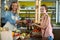 Vendor giving beetroot to the woman at the grocery store