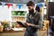 Vendor using digital tablet at the counter at grocery store