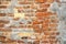 Venetian building weathered wall surface brick wall detail.