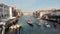 Venetian canal with gondole and boats in Venice, Italy