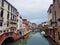 Venetian canal after the rain, ancient architecture of Italy