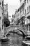 Venetian canal with small bridge