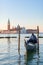 Venetian gondola with San Giorgio Maggiore church at background in Venice
