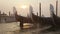 Venetian gondolas tied near the pier on San Marco square at sunrise. Timelapse